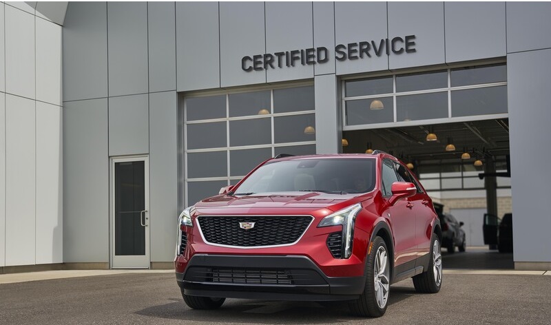 Red Cadillac outside certified service center