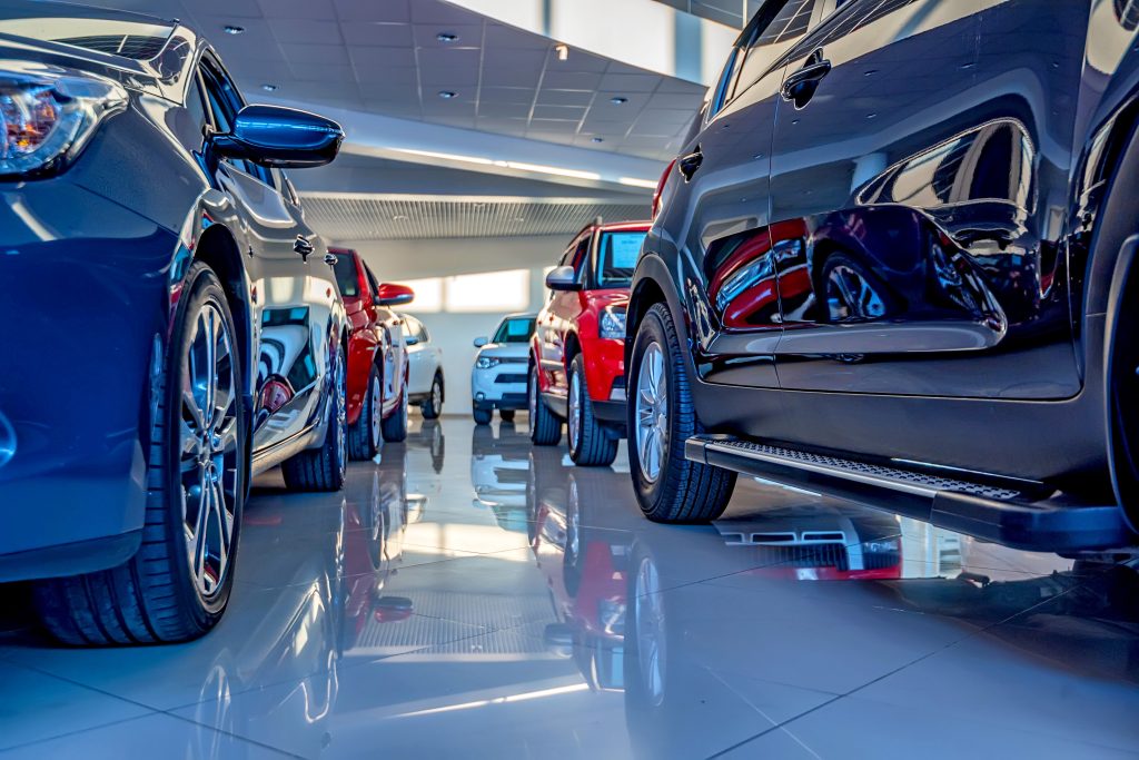 Cars displayed inside a modern dealership showroom