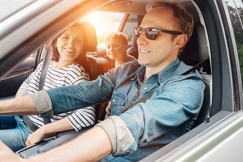 Family riding in their new car